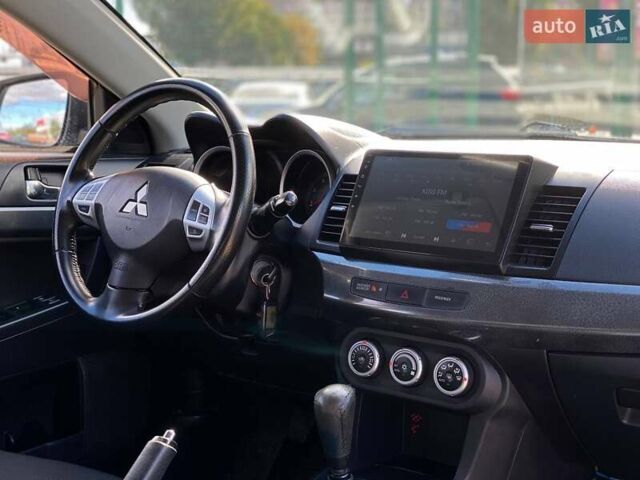 Серый Мицубиси Лансер, объемом двигателя 2 л и пробегом 150 тыс. км за 6100 $, фото 17 на Automoto.ua