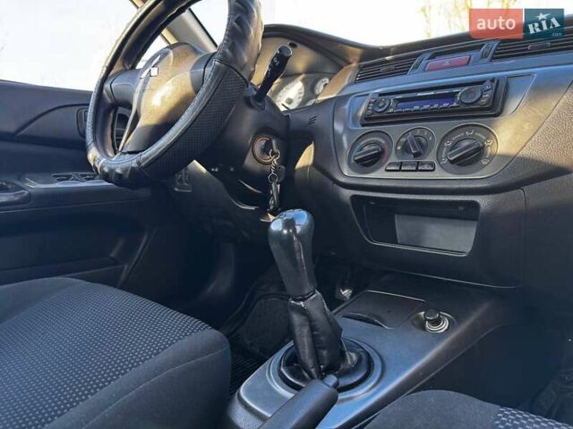Сірий Міцубісі Lancer, об'ємом двигуна 1.6 л та пробігом 237 тис. км за 4950 $, фото 9 на Automoto.ua