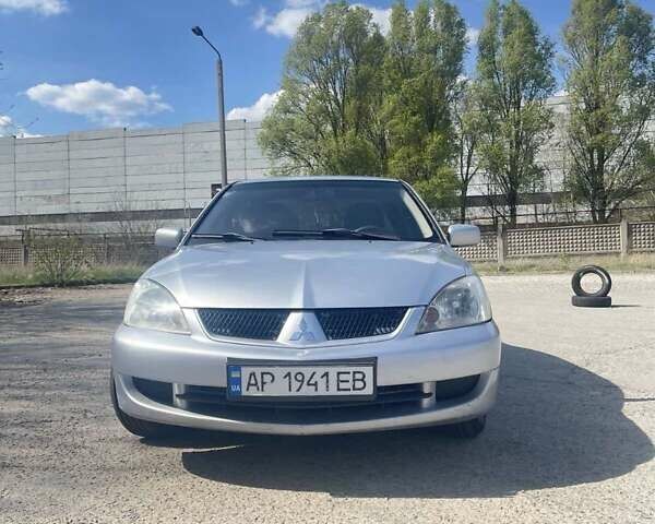 Сірий Міцубісі Lancer, об'ємом двигуна 1.58 л та пробігом 248 тис. км за 4999 $, фото 1 на Automoto.ua