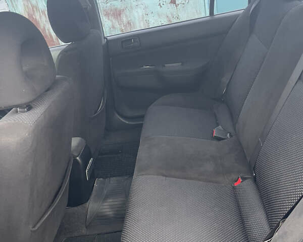 Серый Мицубиси Лансер, объемом двигателя 1.58 л и пробегом 205 тыс. км за 4750 $, фото 7 на Automoto.ua