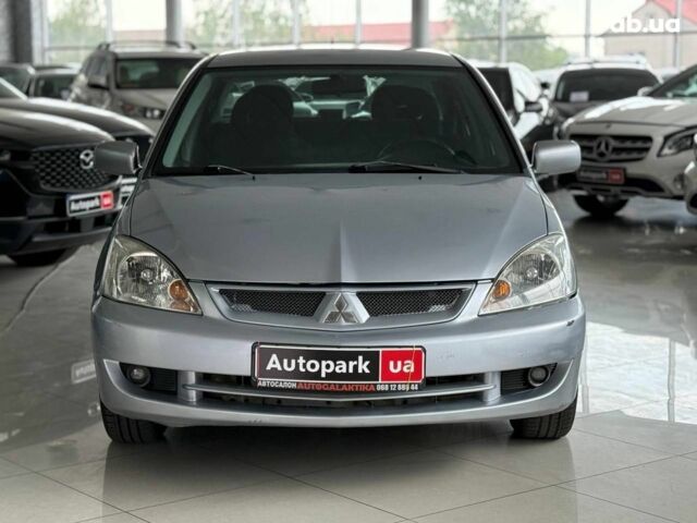 Серый Мицубиси Лансер, объемом двигателя 1.6 л и пробегом 174 тыс. км за 5990 $, фото 1 на Automoto.ua