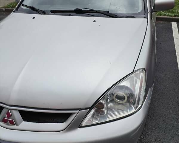 Серый Мицубиси Лансер, объемом двигателя 1.6 л и пробегом 210 тыс. км за 3500 $, фото 2 на Automoto.ua