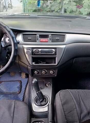 Серый Мицубиси Лансер, объемом двигателя 1.58 л и пробегом 300 тыс. км за 4400 $, фото 7 на Automoto.ua