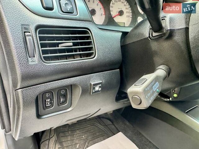Сірий Міцубісі Lancer, об'ємом двигуна 1.58 л та пробігом 138 тис. км за 4990 $, фото 26 на Automoto.ua