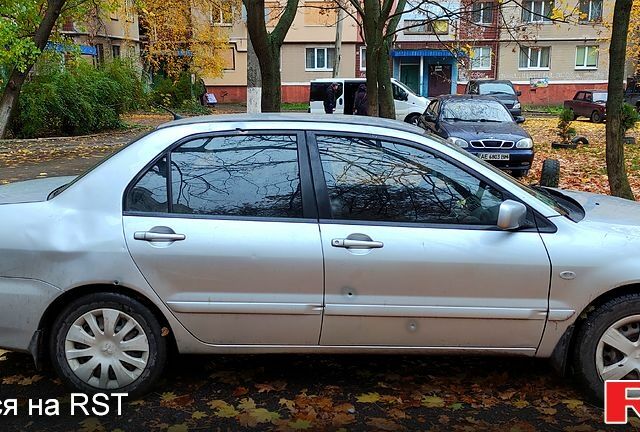 Серый Мицубиси Лансер, объемом двигателя 1.6 л и пробегом 430 тыс. км за 2500 $, фото 2 на Automoto.ua