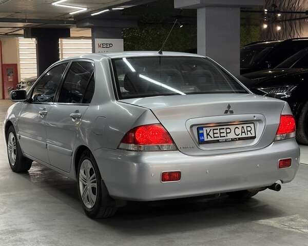 Серый Мицубиси Лансер, объемом двигателя 1.58 л и пробегом 271 тыс. км за 4200 $, фото 12 на Automoto.ua