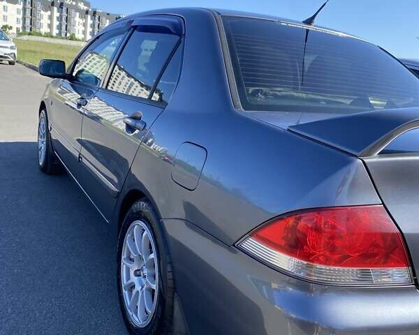 Сірий Міцубісі Lancer, об'ємом двигуна 1.6 л та пробігом 293 тис. км за 5000 $, фото 2 на Automoto.ua