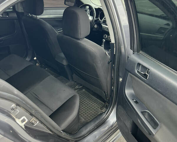 Сірий Міцубісі Lancer, об'ємом двигуна 2 л та пробігом 300 тис. км за 6299 $, фото 19 на Automoto.ua