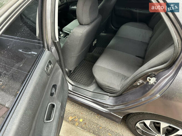 Серый Мицубиси Лансер, объемом двигателя 1.6 л и пробегом 115 тыс. км за 2800 $, фото 13 на Automoto.ua