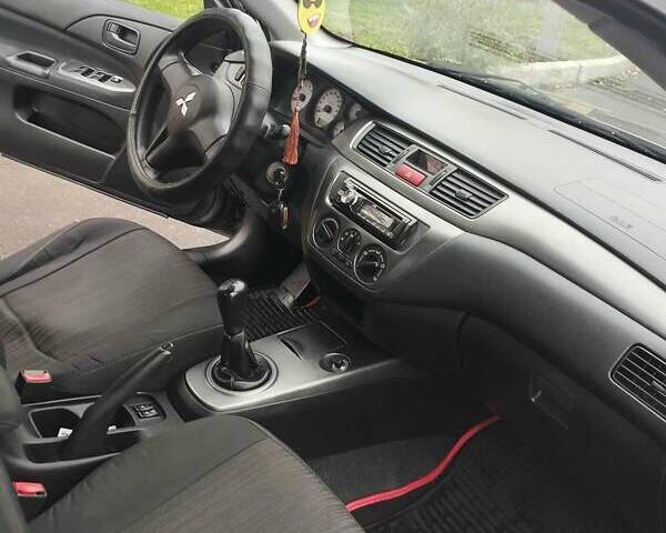 Серый Мицубиси Лансер, объемом двигателя 1.6 л и пробегом 181 тыс. км за 4500 $, фото 14 на Automoto.ua