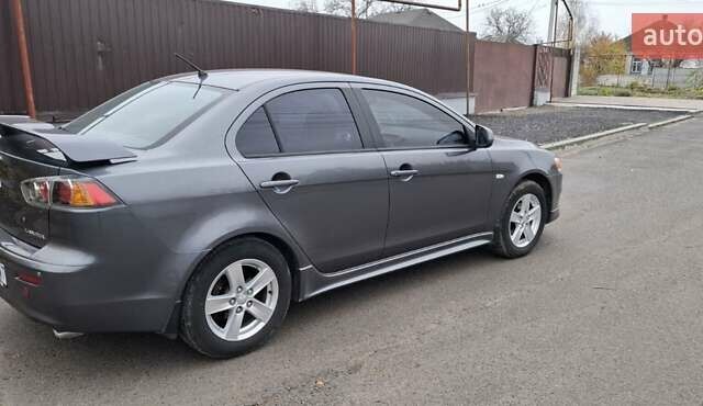 Серый Мицубиси Лансер, объемом двигателя 2 л и пробегом 189 тыс. км за 6800 $, фото 1 на Automoto.ua