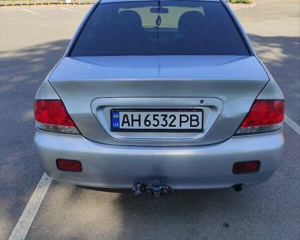 Серый Мицубиси Лансер, объемом двигателя 1.6 л и пробегом 187 тыс. км за 4500 $, фото 1 на Automoto.ua