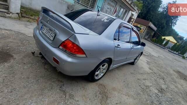 Сірий Міцубісі Lancer, об'ємом двигуна 1.6 л та пробігом 298 тис. км за 4100 $, фото 87 на Automoto.ua