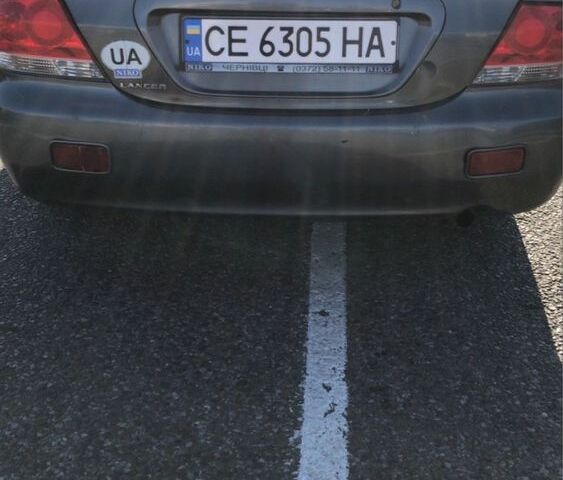 Серый Мицубиси Лансер, объемом двигателя 1.5 л и пробегом 269 тыс. км за 4200 $, фото 8 на Automoto.ua