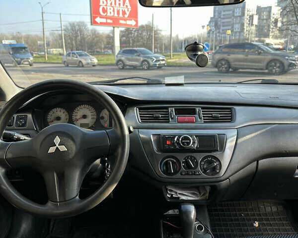 Сірий Міцубісі Lancer, об'ємом двигуна 1.6 л та пробігом 249 тис. км за 5100 $, фото 7 на Automoto.ua