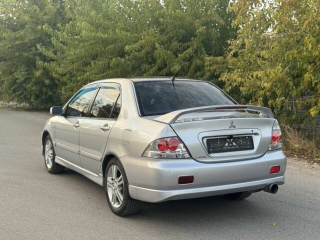 Серый Мицубиси Лансер, объемом двигателя 2 л и пробегом 185 тыс. км за 4600 $, фото 6 на Automoto.ua