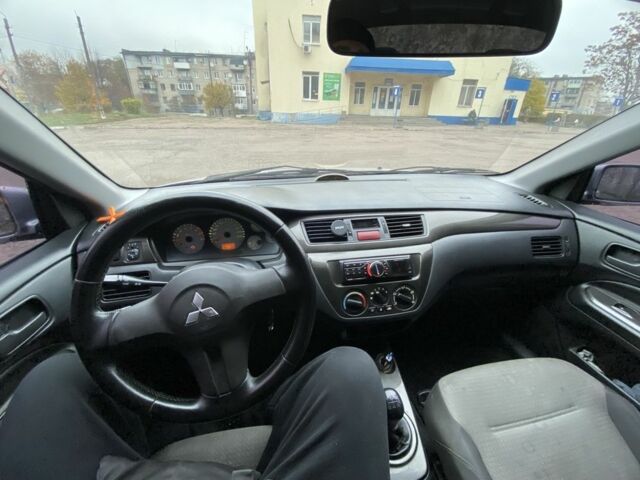 Серый Мицубиси Лансер, объемом двигателя 1.6 л и пробегом 380 тыс. км за 4000 $, фото 9 на Automoto.ua