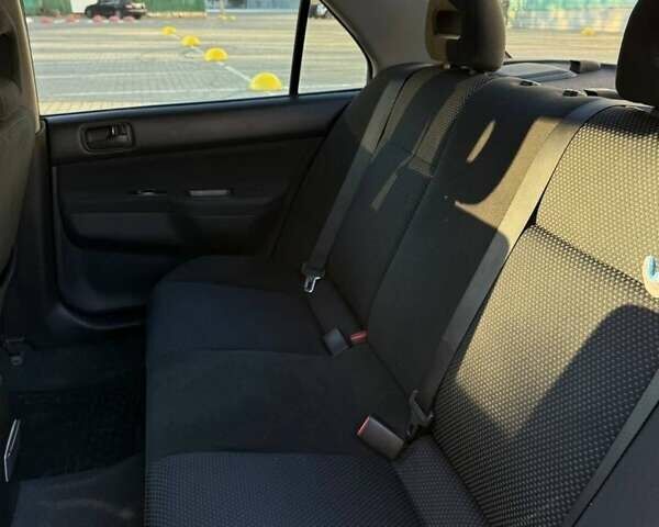 Сірий Міцубісі Lancer, об'ємом двигуна 1.6 л та пробігом 174 тис. км за 4800 $, фото 4 на Automoto.ua