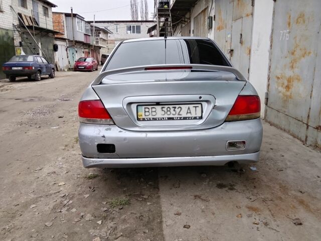 Серый Мицубиси Лансер, объемом двигателя 2 л и пробегом 495 тыс. км за 2800 $, фото 1 на Automoto.ua