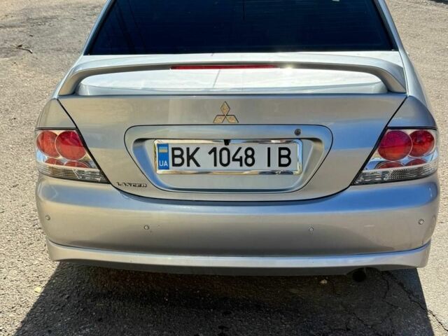 Серый Мицубиси Лансер, объемом двигателя 2 л и пробегом 231 тыс. км за 4500 $, фото 4 на Automoto.ua