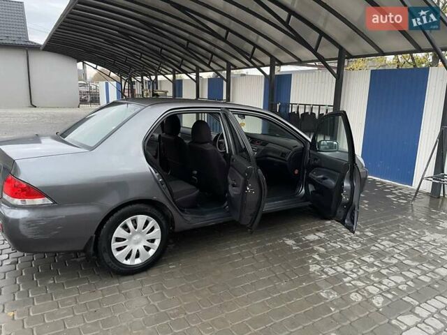 Сірий Міцубісі Lancer, об'ємом двигуна 1.6 л та пробігом 330 тис. км за 3500 $, фото 22 на Automoto.ua