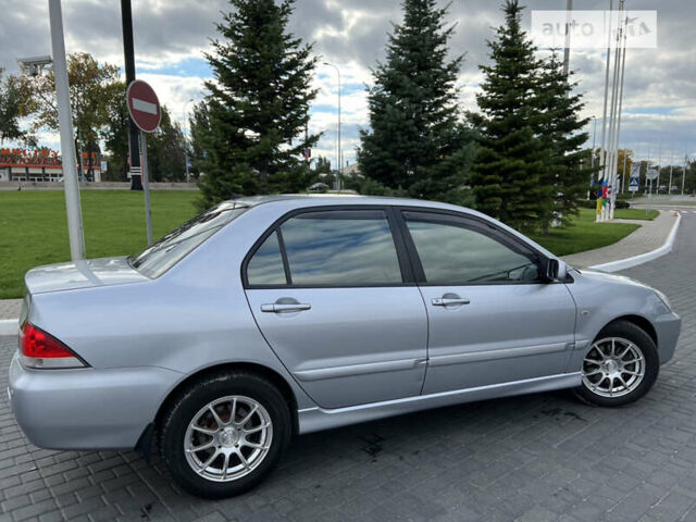 Сірий Міцубісі Lancer, об'ємом двигуна 1.6 л та пробігом 204 тис. км за 5250 $, фото 7 на Automoto.ua