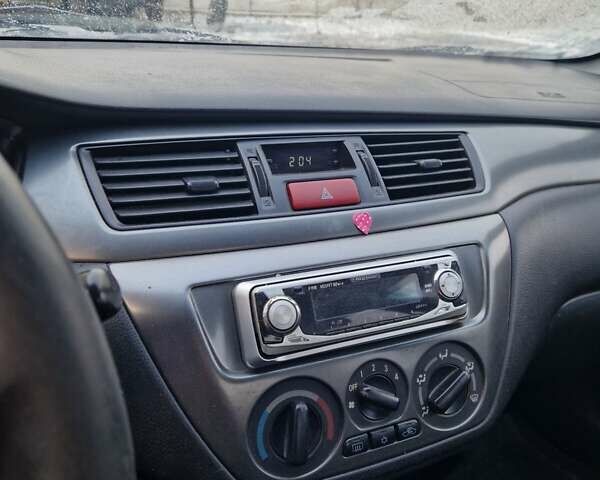 Сірий Міцубісі Lancer, об'ємом двигуна 1.6 л та пробігом 160 тис. км за 3800 $, фото 5 на Automoto.ua