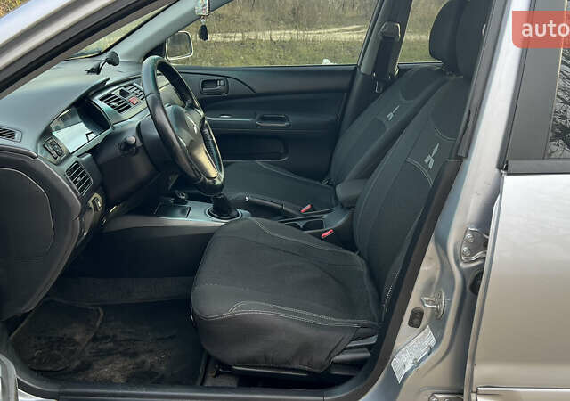 Серый Мицубиси Лансер, объемом двигателя 1.58 л и пробегом 290 тыс. км за 3750 $, фото 6 на Automoto.ua