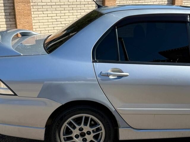 Серый Мицубиси Лансер, объемом двигателя 2 л и пробегом 231 тыс. км за 4500 $, фото 5 на Automoto.ua