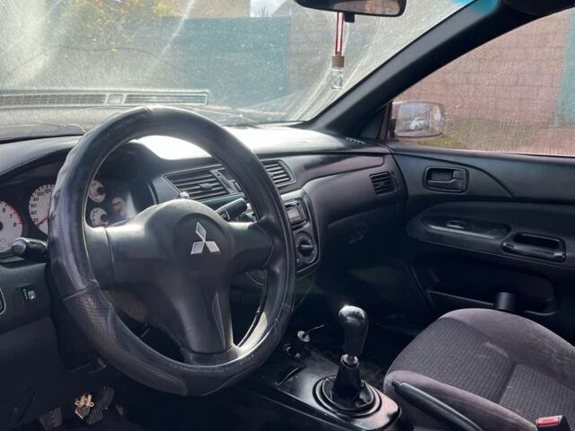 Серый Мицубиси Лансер, объемом двигателя 1.6 л и пробегом 200 тыс. км за 2300 $, фото 4 на Automoto.ua