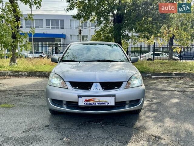 Сірий Міцубісі Lancer, об'ємом двигуна 1.58 л та пробігом 138 тис. км за 4990 $, фото 6 на Automoto.ua