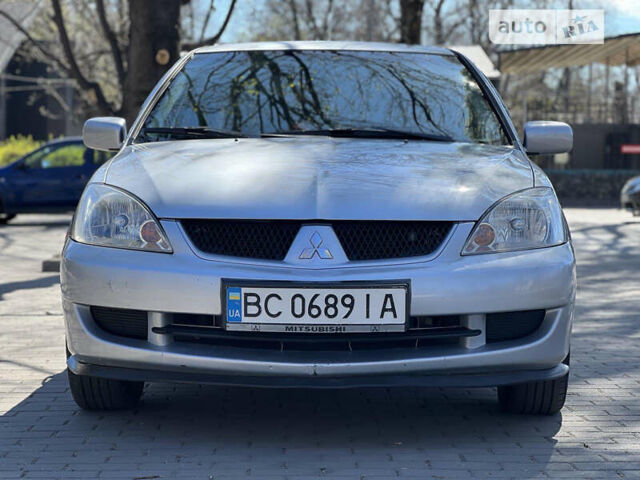 Сірий Міцубісі Lancer, об'ємом двигуна 1.58 л та пробігом 275 тис. км за 4299 $, фото 2 на Automoto.ua