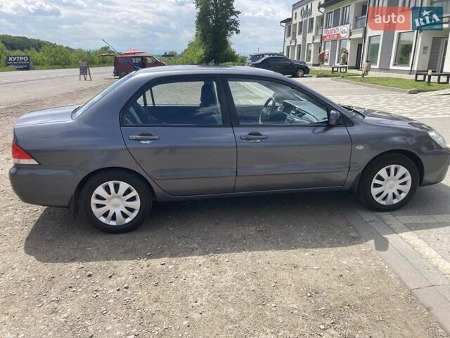 Сірий Міцубісі Lancer, об'ємом двигуна 1.59 л та пробігом 44 тис. км за 6200 $, фото 6 на Automoto.ua