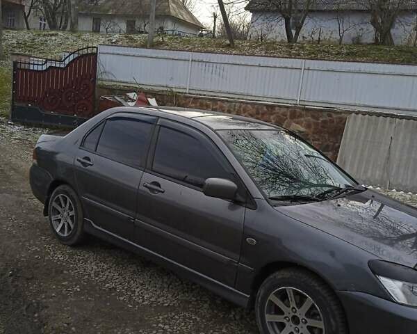 Сірий Міцубісі Lancer, об'ємом двигуна 1.6 л та пробігом 337 тис. км за 4600 $, фото 15 на Automoto.ua