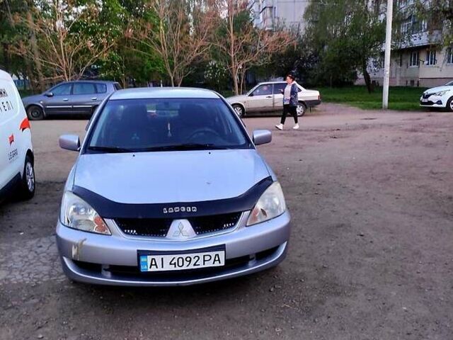 Серый Мицубиси Лансер, объемом двигателя 1.6 л и пробегом 302 тыс. км за 3200 $, фото 5 на Automoto.ua