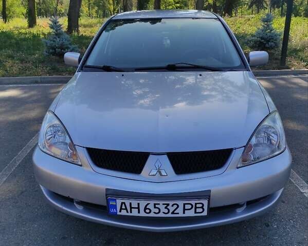 Серый Мицубиси Лансер, объемом двигателя 1.6 л и пробегом 187 тыс. км за 4500 $, фото 2 на Automoto.ua