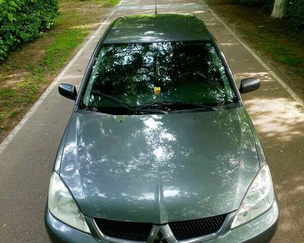 Сірий Міцубісі Lancer, об'ємом двигуна 1.58 л та пробігом 220 тис. км за 4500 $, фото 8 на Automoto.ua