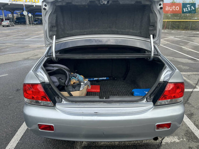 Серый Мицубиси Лансер, объемом двигателя 1.58 л и пробегом 232 тыс. км за 4900 $, фото 26 на Automoto.ua
