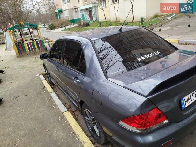 Сірий Міцубісі Lancer, об'ємом двигуна 1.58 л та пробігом 250 тис. км за 4750 $, фото 5 на Automoto.ua