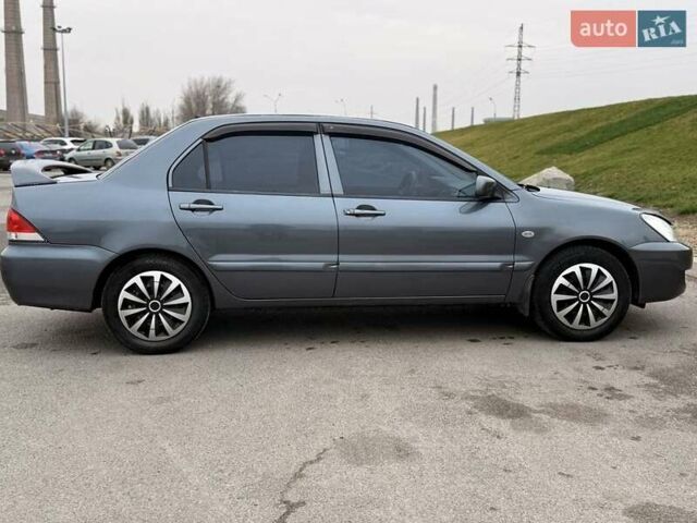 Сірий Міцубісі Lancer, об'ємом двигуна 1.6 л та пробігом 270 тис. км за 4300 $, фото 1 на Automoto.ua