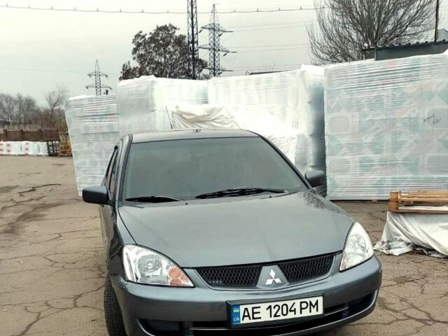 Серый Мицубиси Лансер, объемом двигателя 1.6 л и пробегом 220 тыс. км за 4200 $, фото 1 на Automoto.ua
