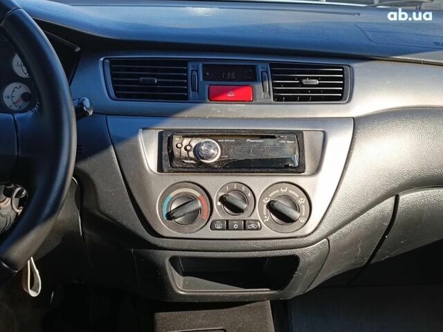 Сірий Міцубісі Lancer, об'ємом двигуна 1.6 л та пробігом 222 тис. км за 3990 $, фото 25 на Automoto.ua