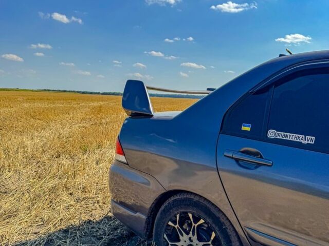 Серый Мицубиси Лансер, объемом двигателя 1.6 л и пробегом 280 тыс. км за 4000 $, фото 3 на Automoto.ua