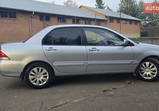 Сірий Міцубісі Lancer, об'ємом двигуна 1.6 л та пробігом 213 тис. км за 3600 $, фото 7 на Automoto.ua