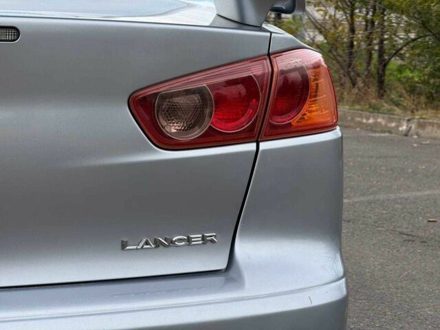 Серый Мицубиси Лансер, объемом двигателя 2 л и пробегом 207 тыс. км за 5800 $, фото 11 на Automoto.ua