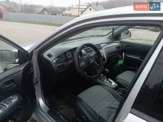 Серый Мицубиси Лансер, объемом двигателя 1.58 л и пробегом 175 тыс. км за 4000 $, фото 6 на Automoto.ua