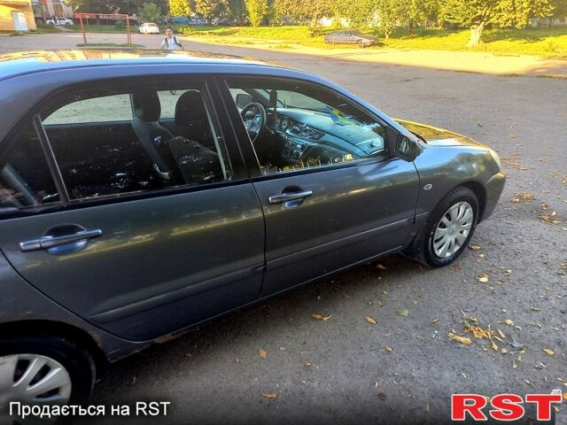 Серый Мицубиси Лансер, объемом двигателя 1.6 л и пробегом 225 тыс. км за 3200 $, фото 8 на Automoto.ua