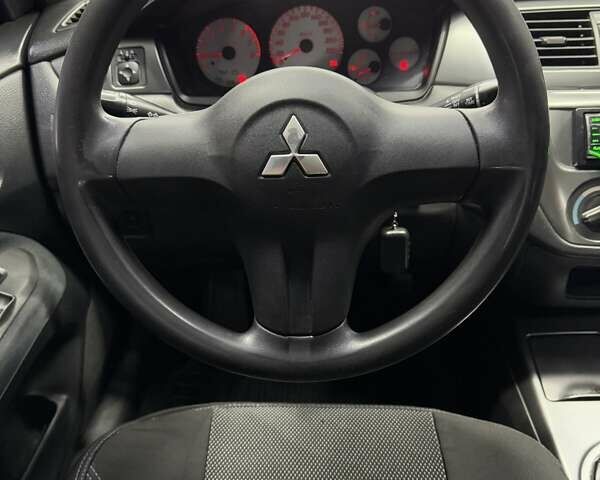 Серый Мицубиси Лансер, объемом двигателя 1.58 л и пробегом 271 тыс. км за 4200 $, фото 27 на Automoto.ua