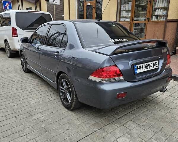 Серый Мицубиси Лансер, объемом двигателя 1.58 л и пробегом 260 тыс. км за 3700 $, фото 2 на Automoto.ua