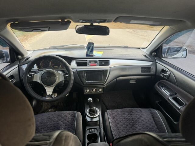 Серый Мицубиси Лансер, объемом двигателя 2 л и пробегом 185 тыс. км за 4600 $, фото 9 на Automoto.ua